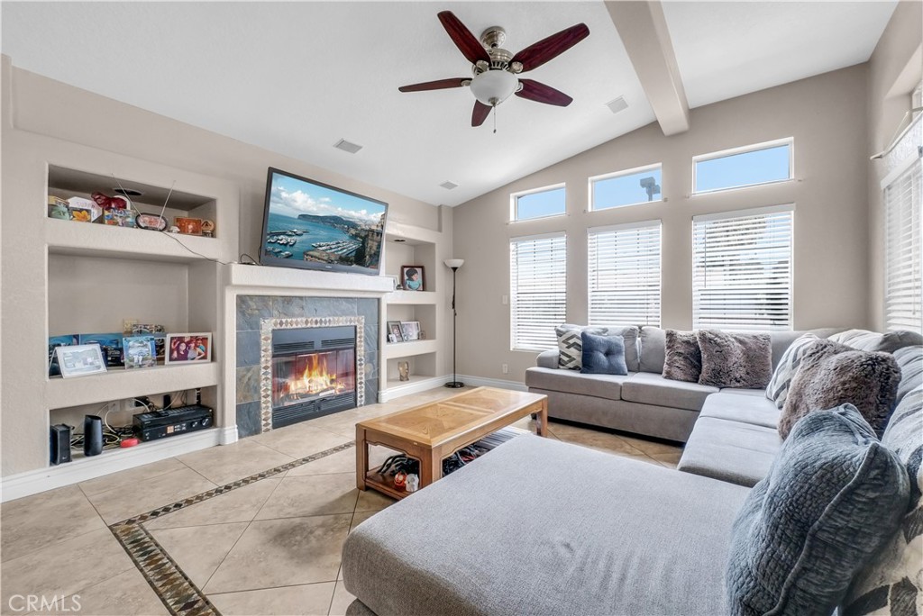 4901 Green River Road, Unit 102 Corona, CA 92878 - Photo 6 of 39 a living room with furniture and a fireplace