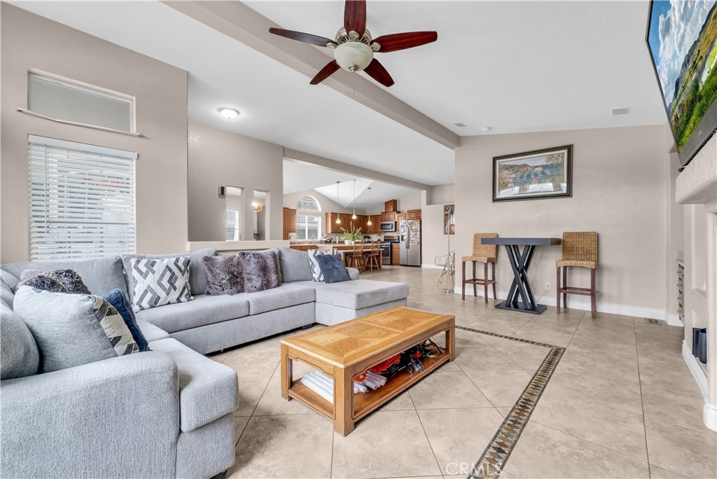 4901 Green River Road, Unit 102 Corona, CA 92878 - Photo 7 of 39 a living room with furniture a table and a potted plant