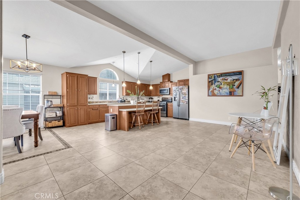 4901 Green River Road, Unit 102 Corona, CA 92878 - Photo 8 of 39 a large kitchen with a table and chairs