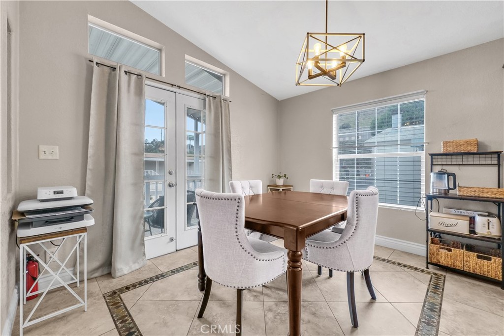4901 Green River Road, Unit 102 Corona, CA 92878 - Photo 9 of 39 a dining room with furniture and window