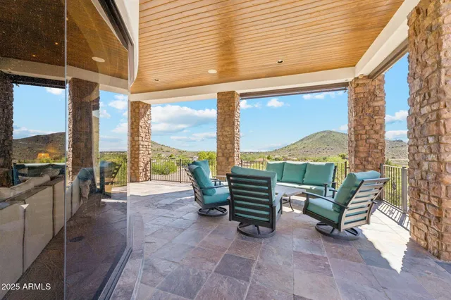 a living room with furniture and a lamp