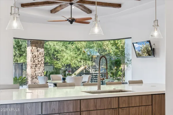 a kitchen with a large window and sink