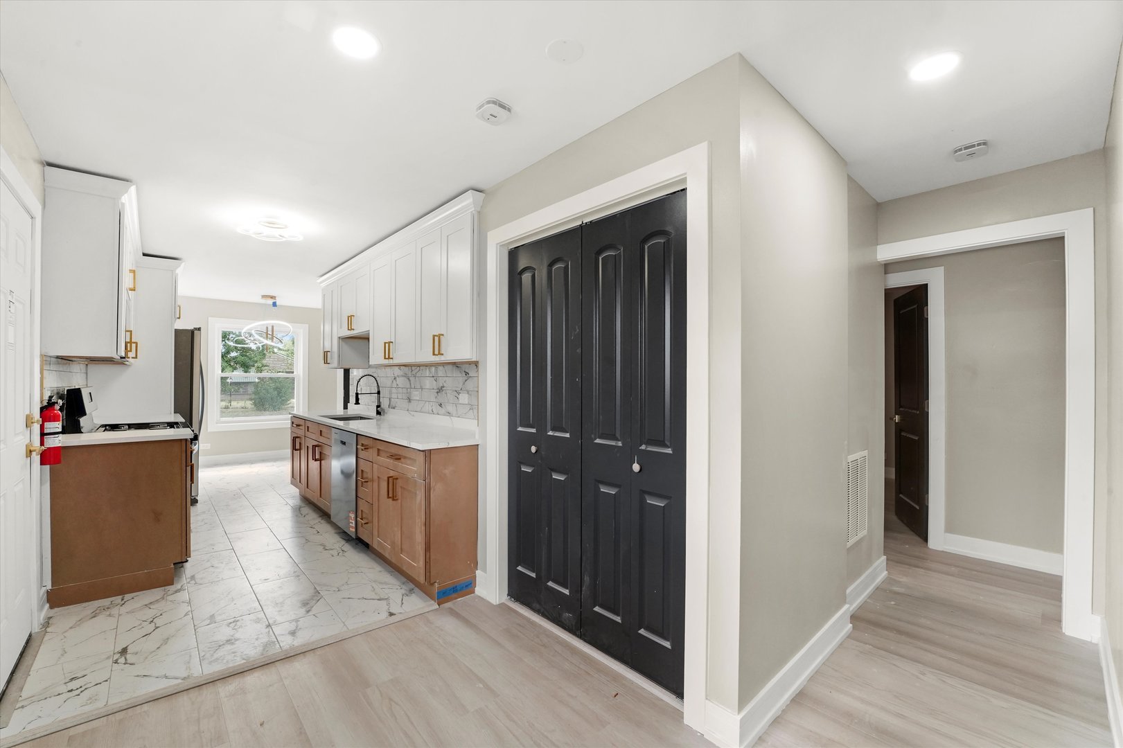 16218 Honore Avenue Markham, IL 60428 - Photo 11 of 25 a view of a kitchen with refrigerator and wooden cabinets