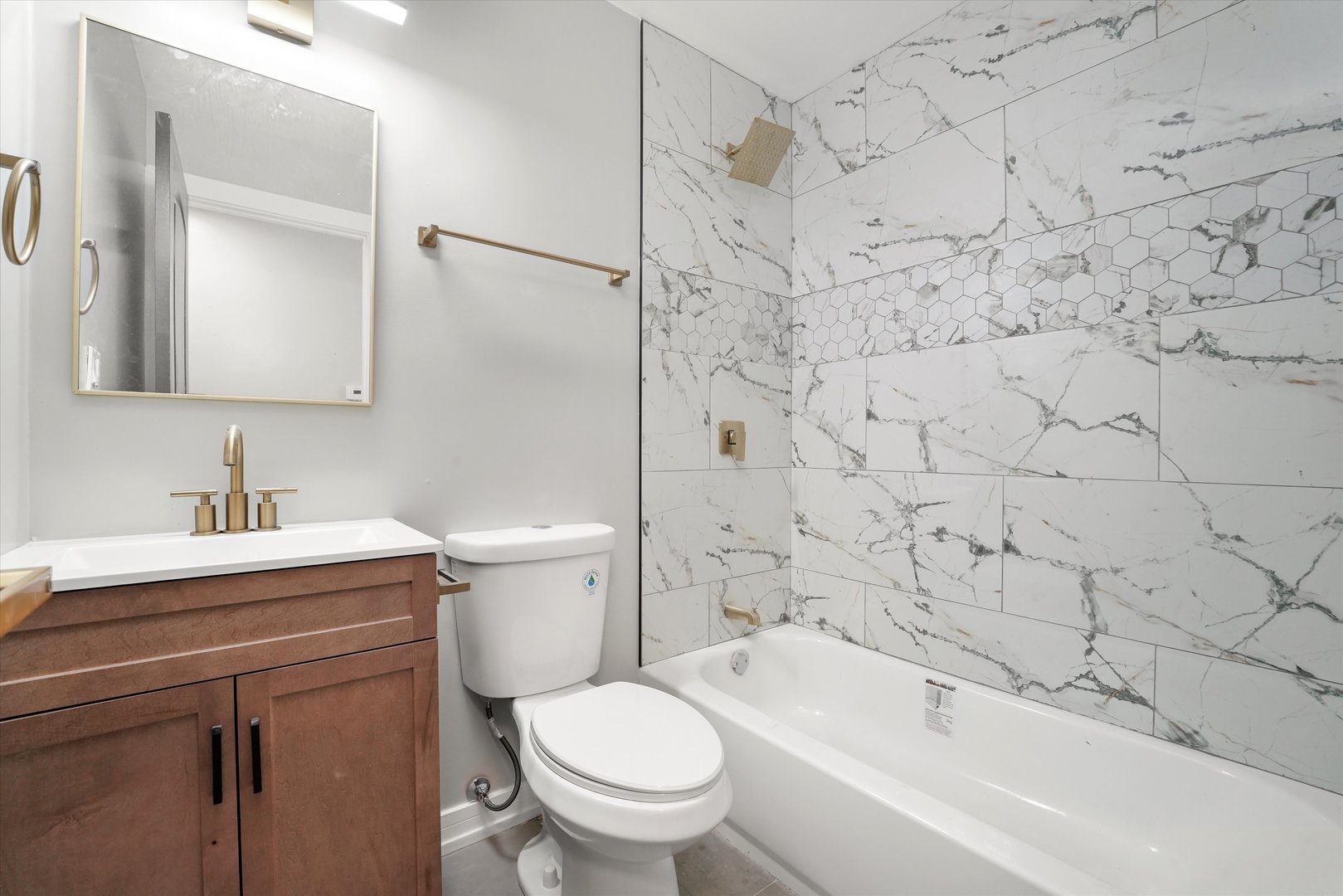 16218 Honore Avenue Markham, IL 60428 - Photo 15 of 25 a bathroom with a sink toilet and shower