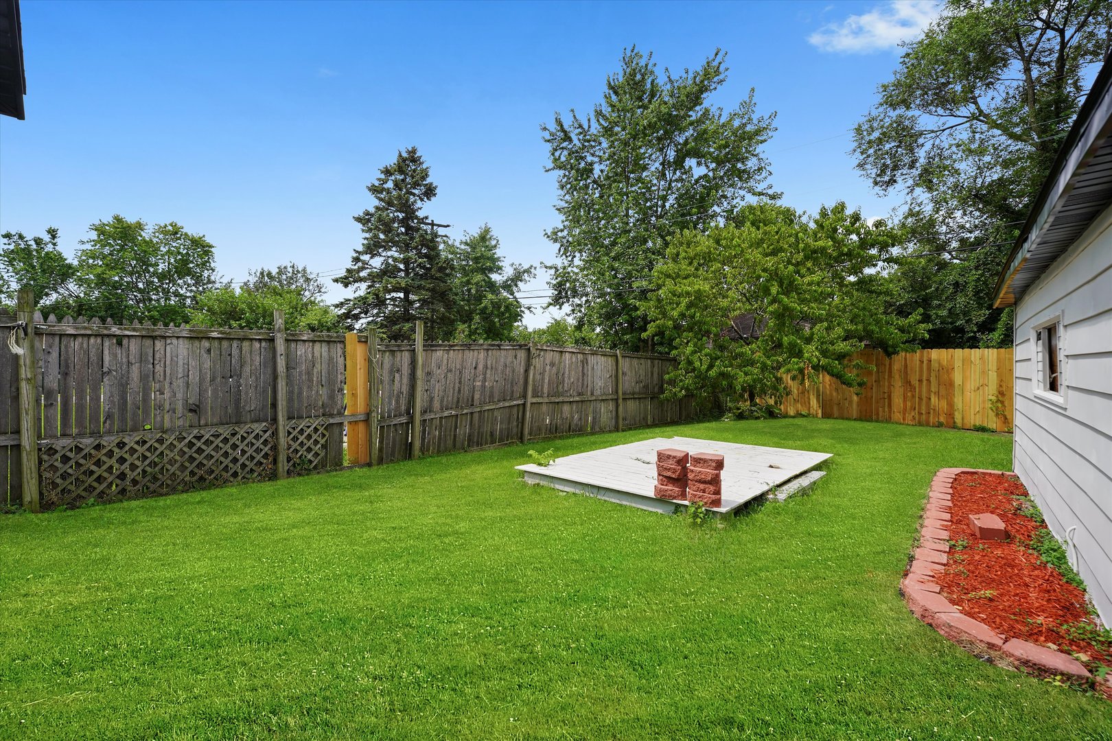 16218 Honore Avenue Markham, IL 60428 - Photo 23 of 25 a garden view with a seating space