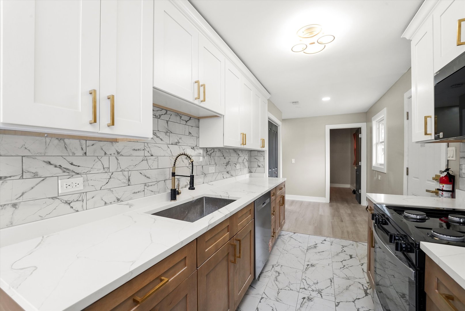 16218 Honore Avenue Markham, IL 60428 - Photo 8 of 25 a kitchen with a sink and cabinets