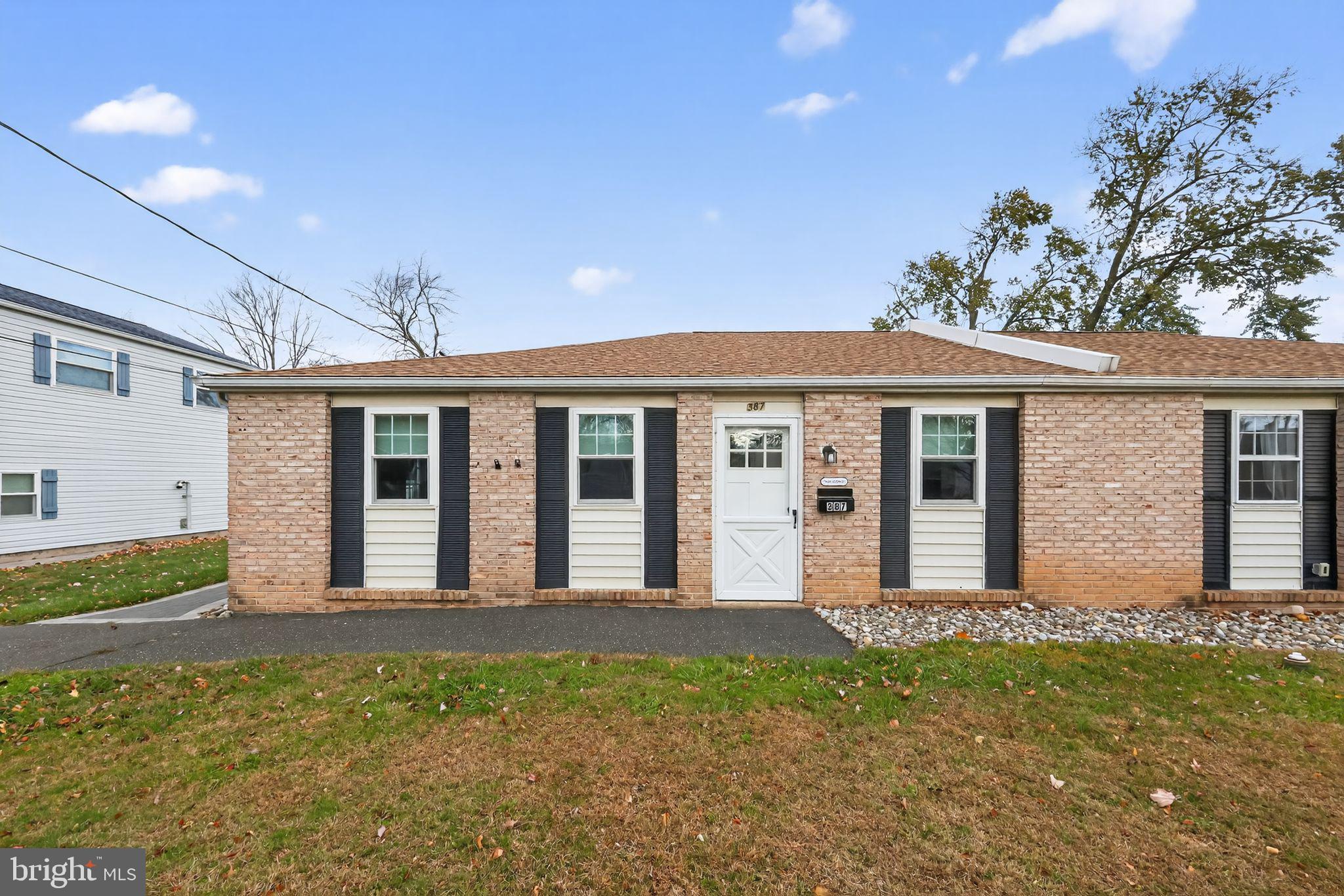 front view of a house with a yard