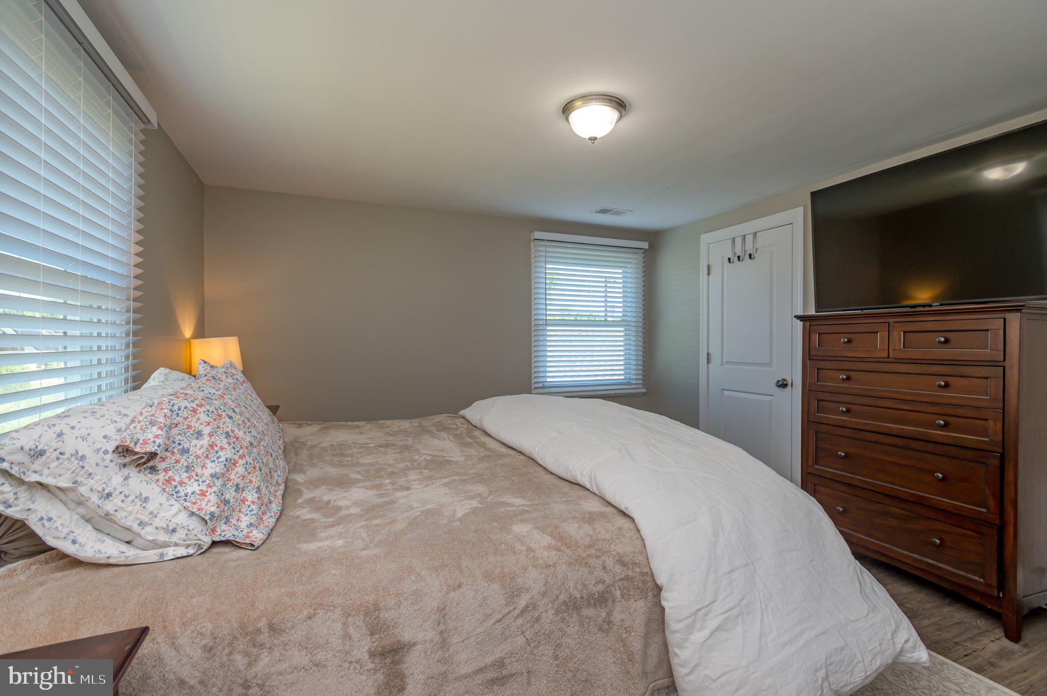 60 Midvale Lane Willingboro, NJ 08046 - Photo 17 of 24 a bedroom with a bed and a television