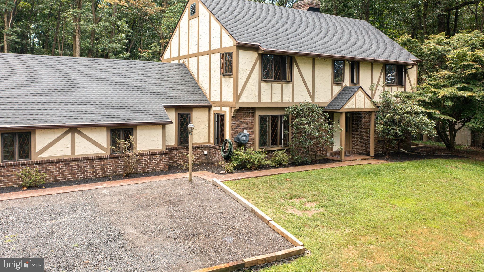An English Tudor Home Nestled in Woods on the Hill