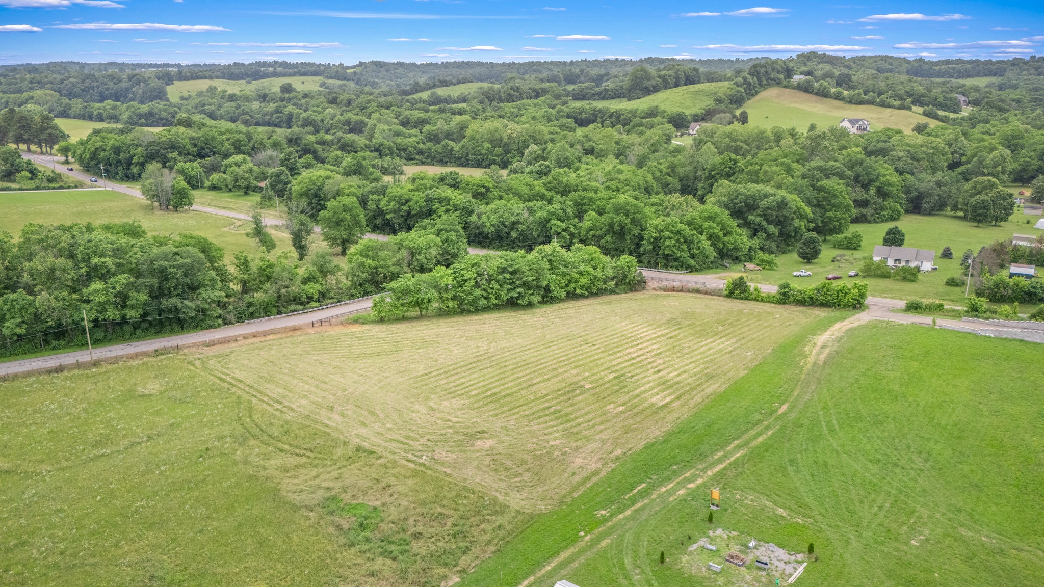 a view of a field with an ocean