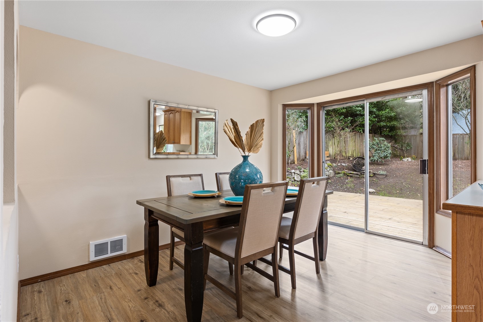 2012 233rd Street Southeast Bothell, WA 98021 - Photo 14 of 39 a view of a dining room with furniture window and wooden floor
