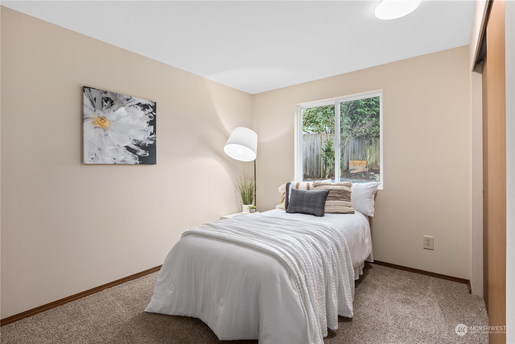 2012 233rd Street Southeast Bothell, WA 98021 - Photo 16 of 39 a bedroom with a bed and a painting on the wall