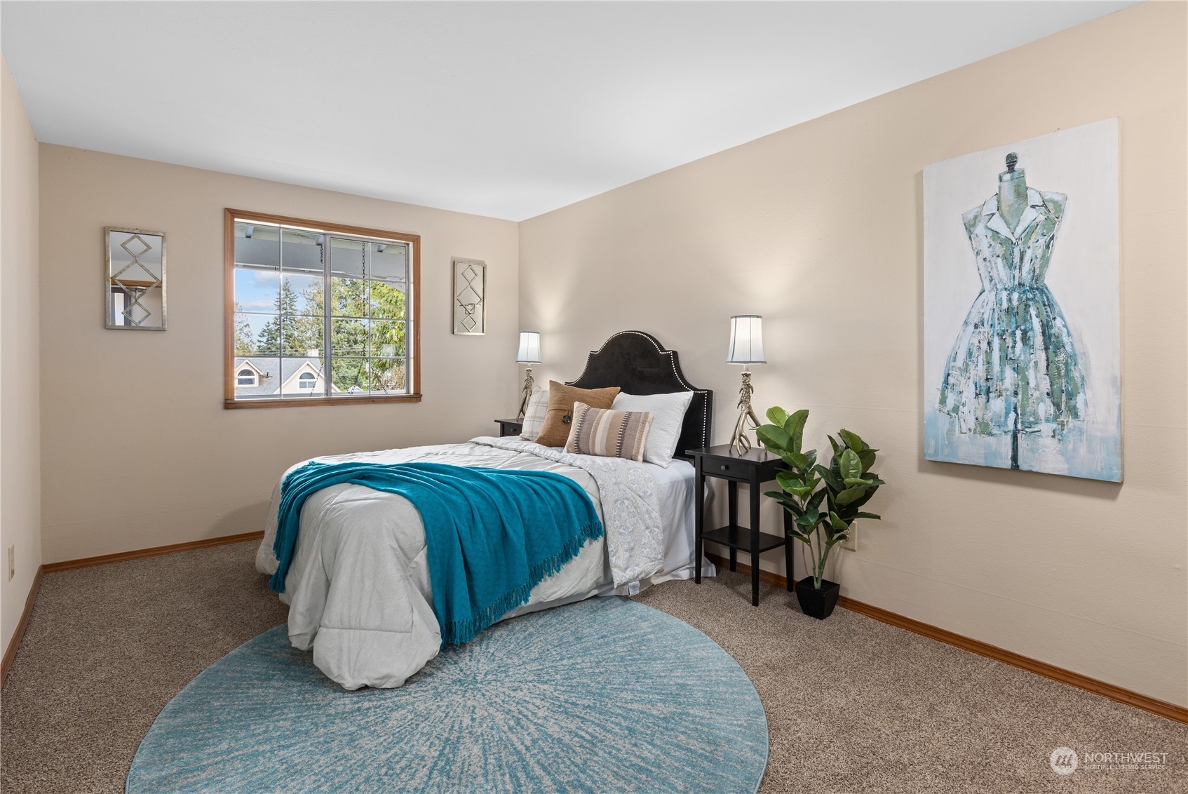 2012 233rd Street Southeast Bothell, WA 98021 - Photo 18 of 39 a bedroom with a bed and a painting on the wall
