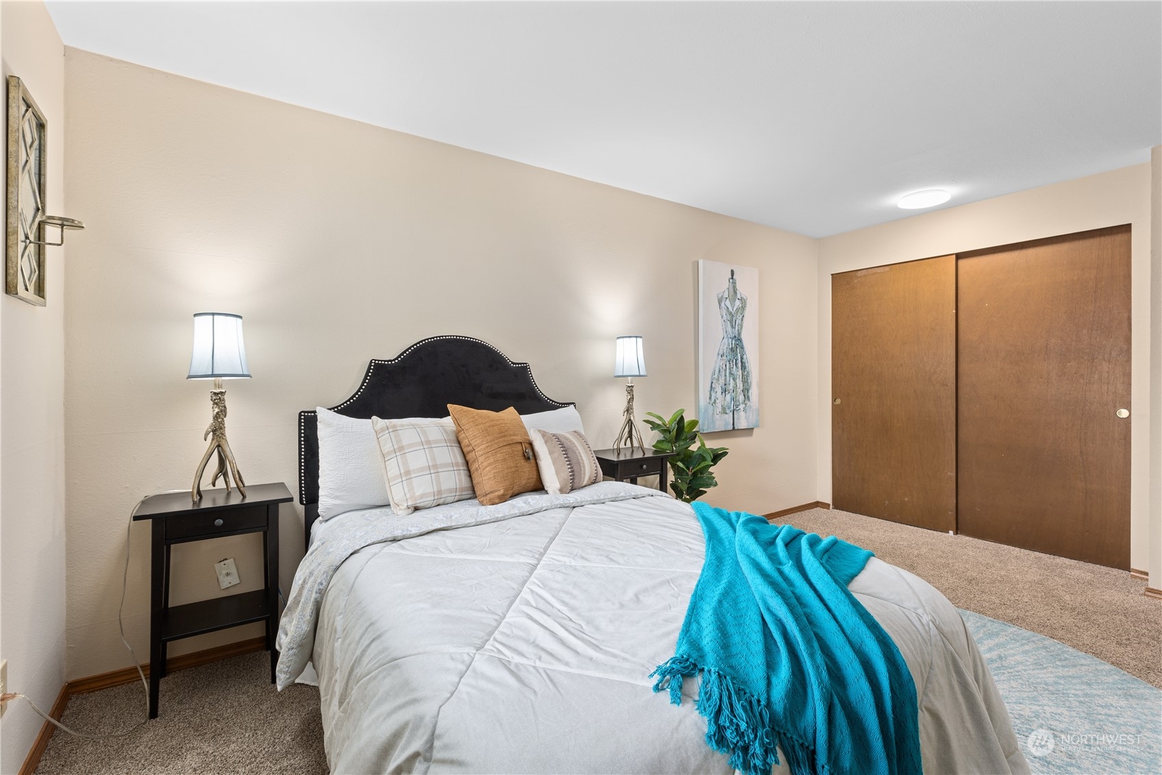 2012 233rd Street Southeast Bothell, WA 98021 - Photo 19 of 39 a bedroom with a bed and a lamp