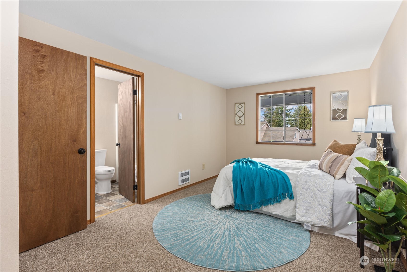 2012 233rd Street Southeast Bothell, WA 98021 - Photo 20 of 39 a bedroom with a bed and a couch