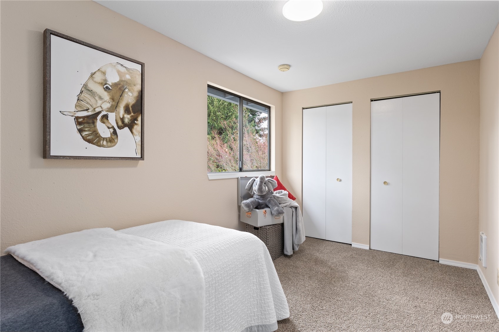 2012 233rd Street Southeast Bothell, WA 98021 - Photo 28 of 39 a bedroom with a bed and a painting on the wall