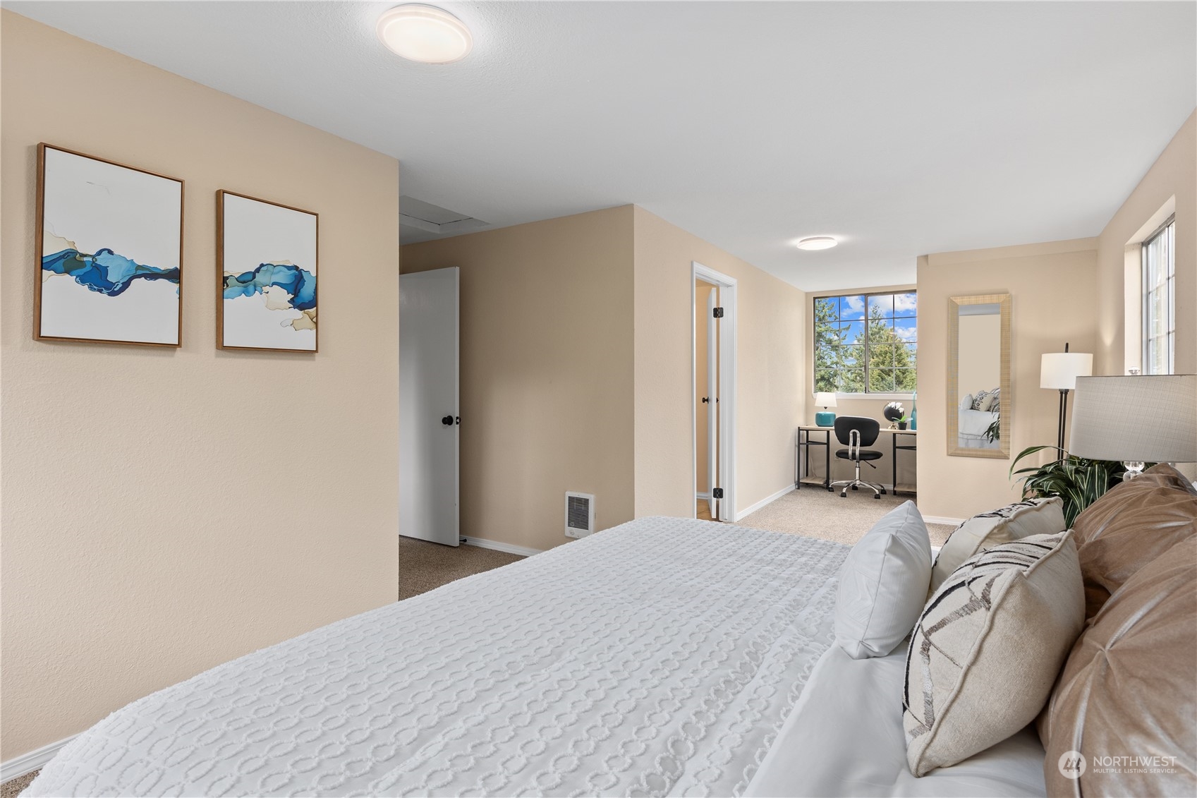 2012 233rd Street Southeast Bothell, WA 98021 - Photo 33 of 39 a bedroom with a large bed and a chandelier