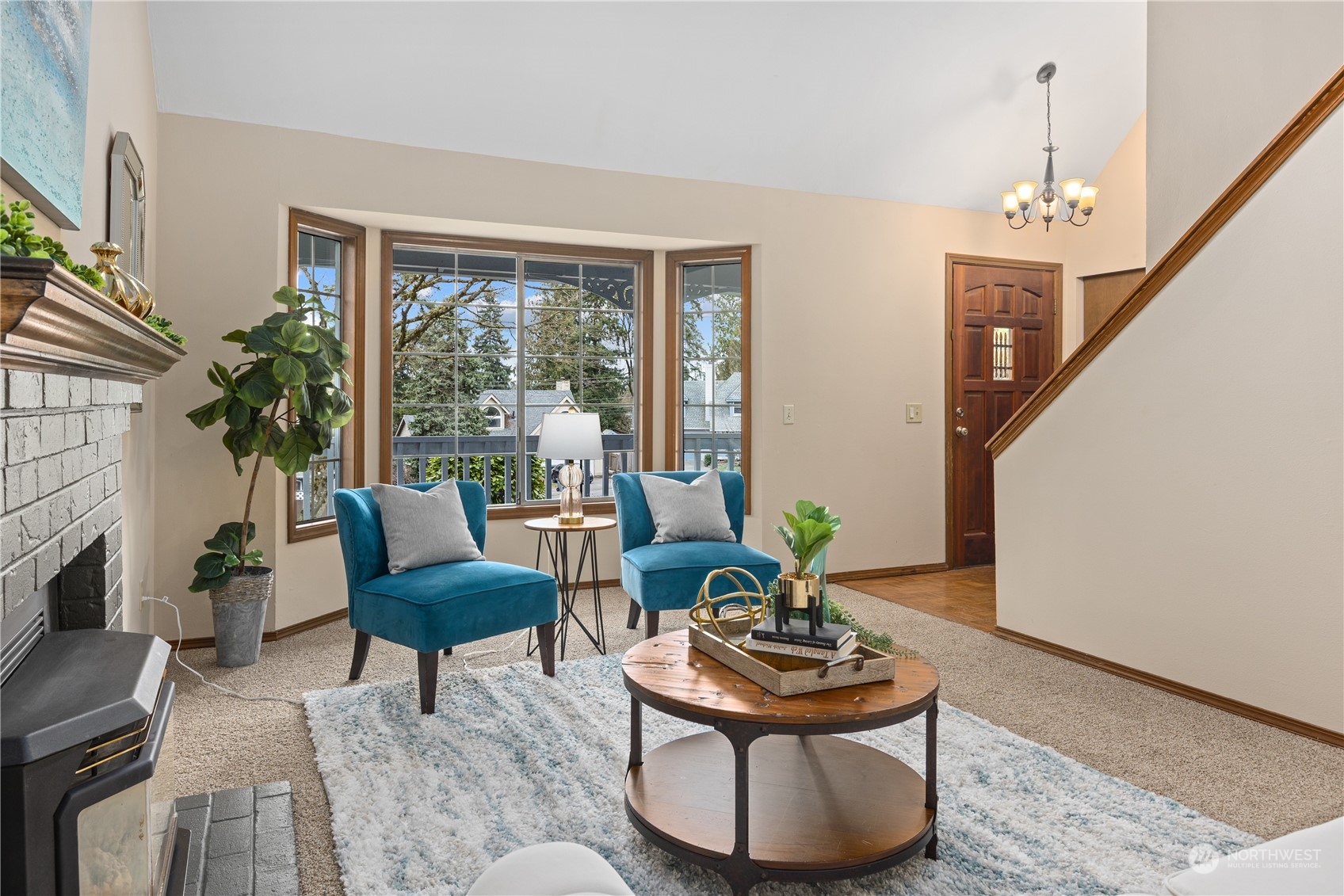 2012 233rd Street Southeast Bothell, WA 98021 - Photo 8 of 39 a living room with furniture and a chandelier