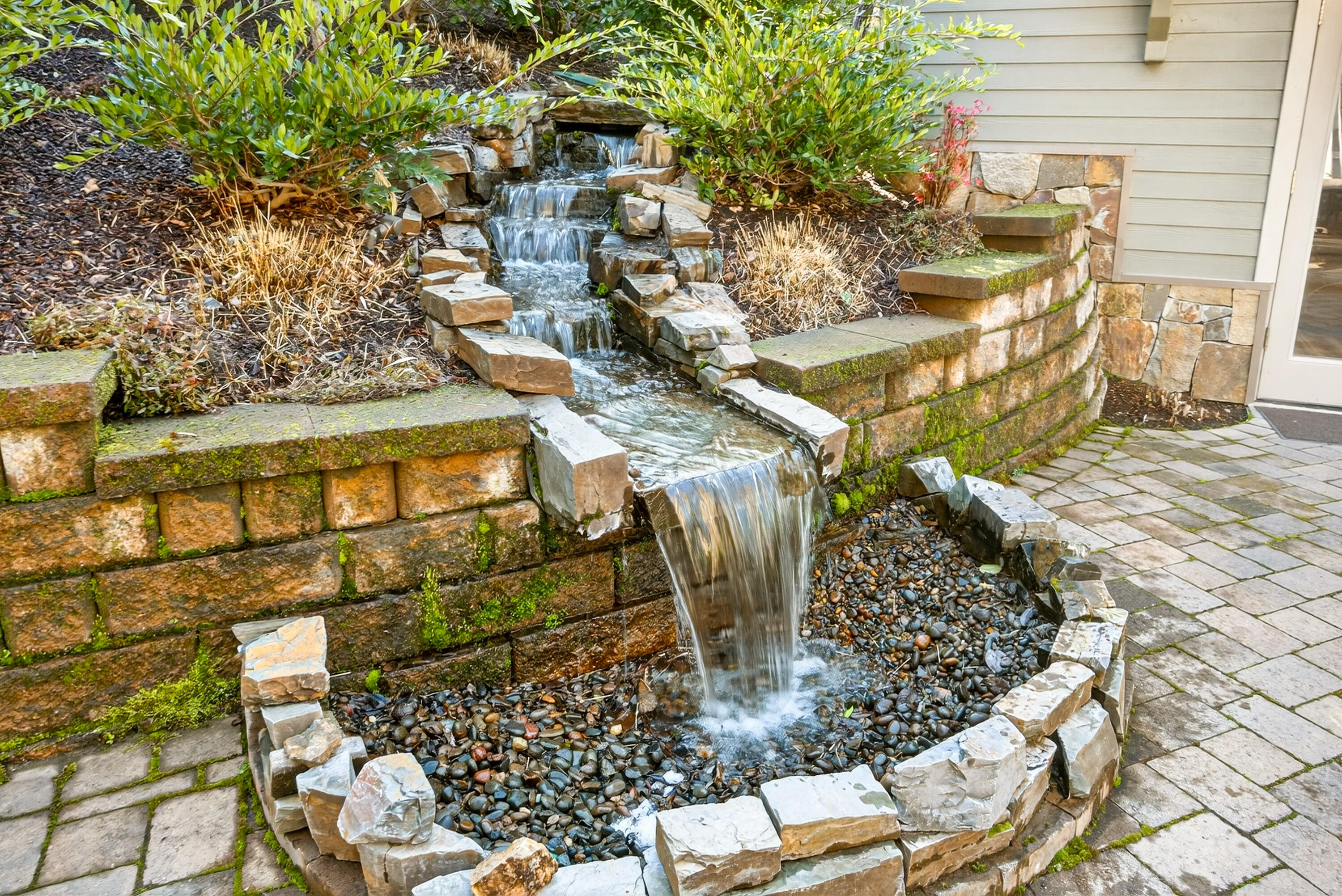 930 Granite Ridge Circle Jacksonville, OR 97530 - Photo 58 of 79 Cascading waterfall of patio.