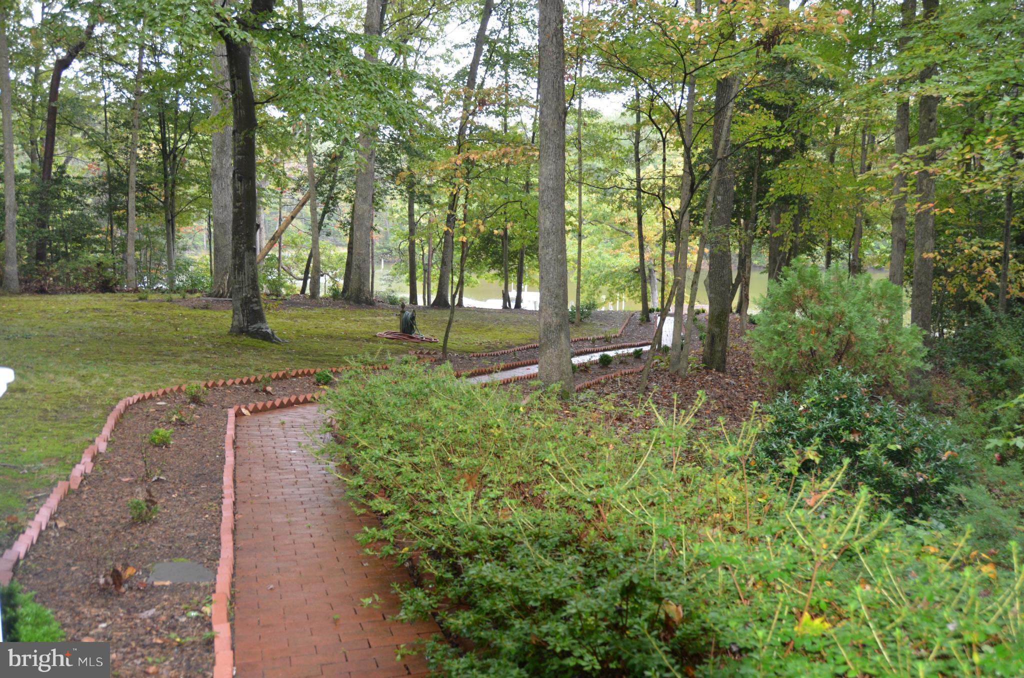 12717 Blair Road Lusby, MD 20657 - Photo 25 of 30 a view of a park with large trees