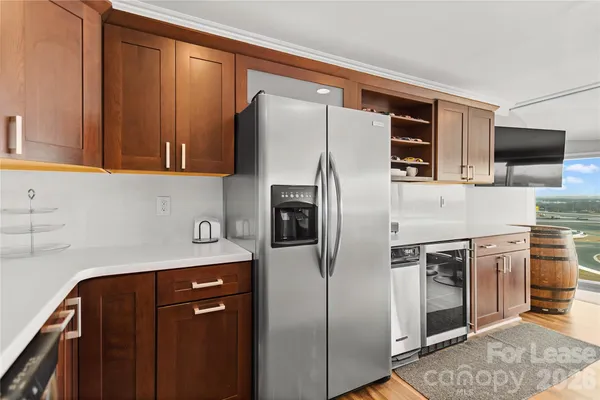 a kitchen with stainless steel appliances granite countertop a stove and a refrigerator