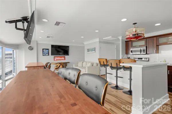 a kitchen with granite countertop a sink stove and cabinets