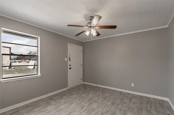 a view of an empty room with a window