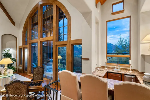 a living room with fireplace furniture and a fireplace