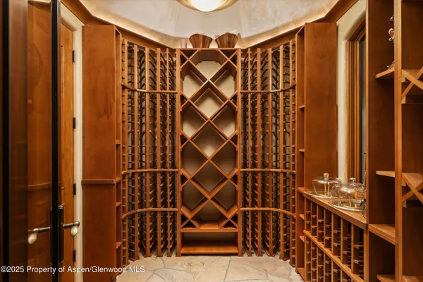 a large kitchen with kitchen island a large counter space a sink stainless steel appliances and cabinets