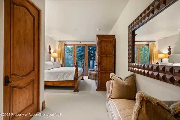 a bathroom with a shower and a sink