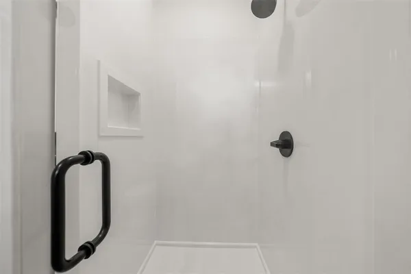 a bathroom with a granite countertop sink toilet and a mirror