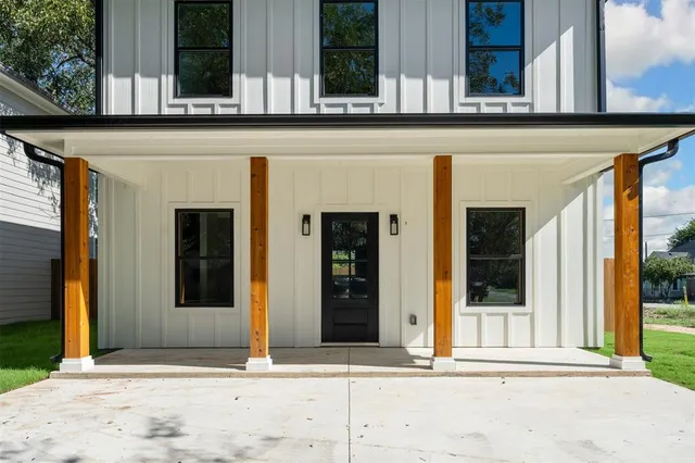 front view of a building with a potted plant