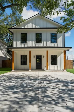 a front view of a house with a garage