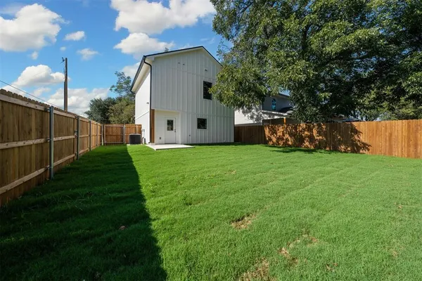 a view of backyard with green space