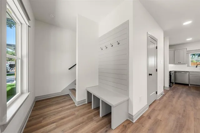 a view of a kitchen with a stove cabinets and wooden floor