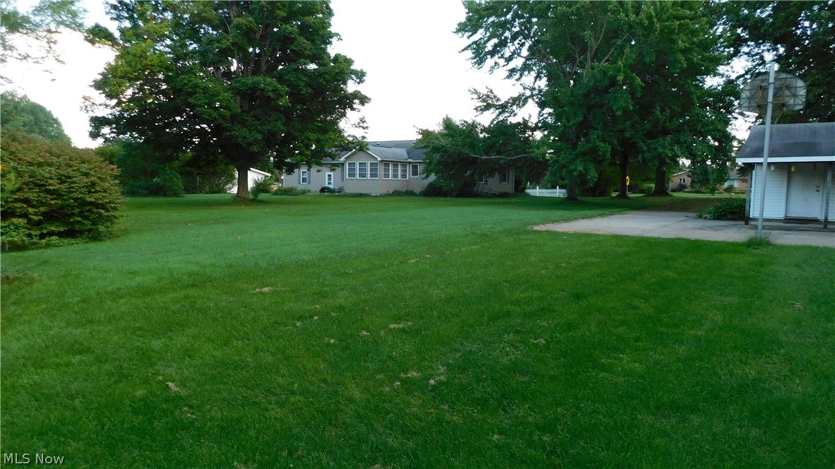 3651 Work Road Ravenna, OH 44266 - Photo 34 of 35 Another view of the large lot, the house has a 13x22 patio on the back of it and the Out building has a covered 8x20 porch as well as 990 sq. ft. of concrete pad that would be great if you have a boat or motor home