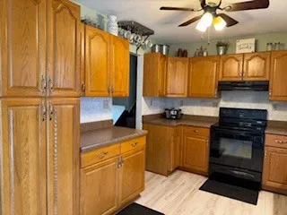a kitchen with a refrigerator and a sink