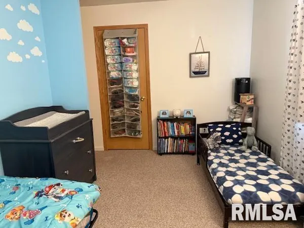 a bedroom with a bed and a cabinets