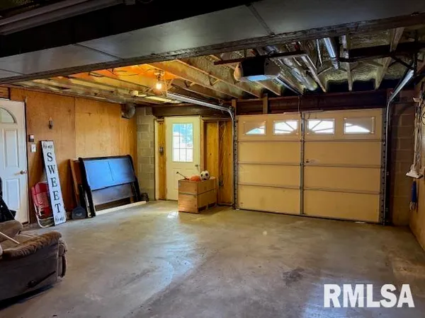 a view of a room with wooden walls
