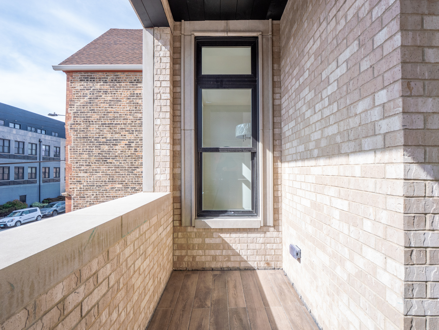 2471 North Clybourn Avenue, Unit 2 Chicago, IL 60614 - Photo 17 of 19 a view of a brick house with a large window