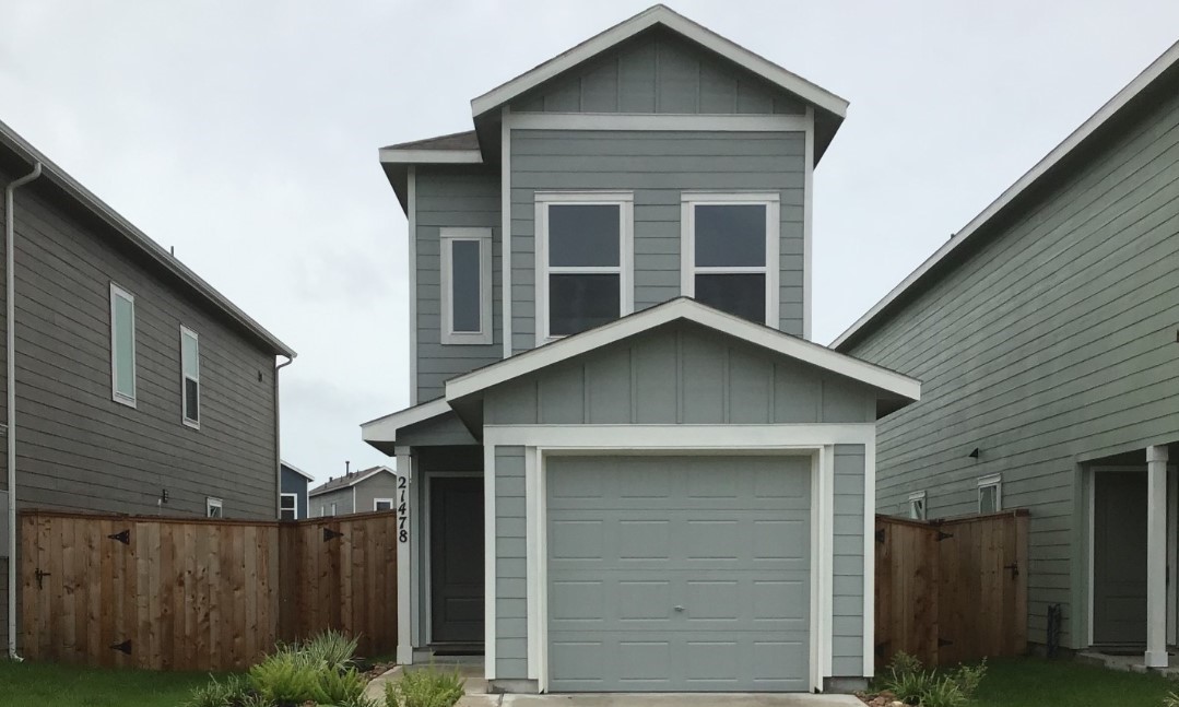 943 Pertuso Lane Huffman, TX 77336 - Photo 2 of 8 a front view of a house with a yard
