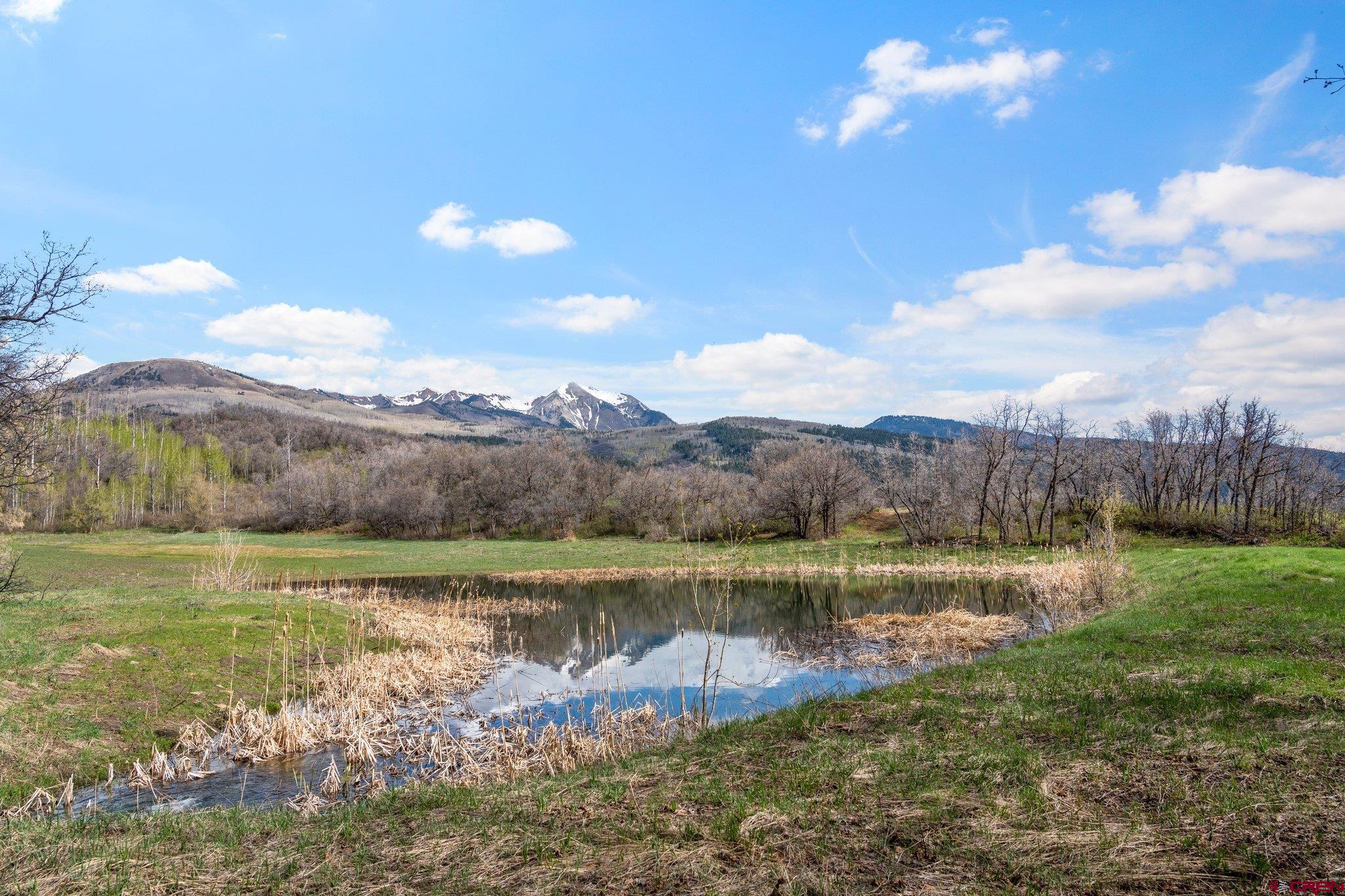 Tbd Tbd Destination Ranch Road Durango, CO 81301 - Photo 9 of 16 a view of a lake with a mountain in the background