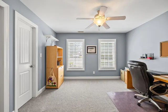 a spacious bedroom with a bed and a chandelier