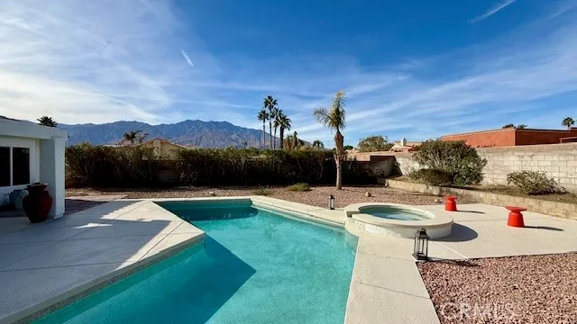 a view of swimming pool with lounge chair