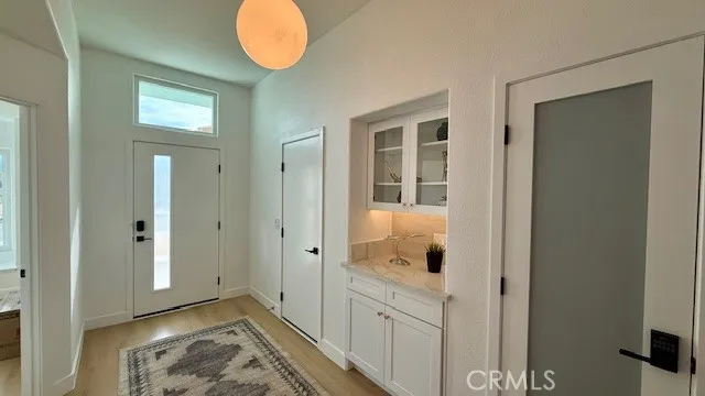 a view of an entryway with wooden floor