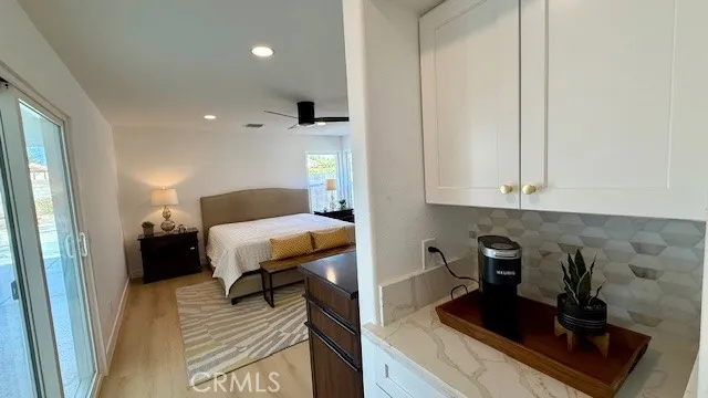 a bedroom with furniture and a rug