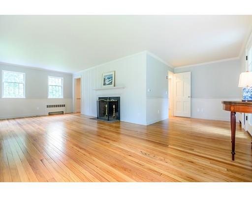 234 Highland Road Andover, MA 01810 - Photo 13 of 29 a view of empty room with wooden floor and fireplace