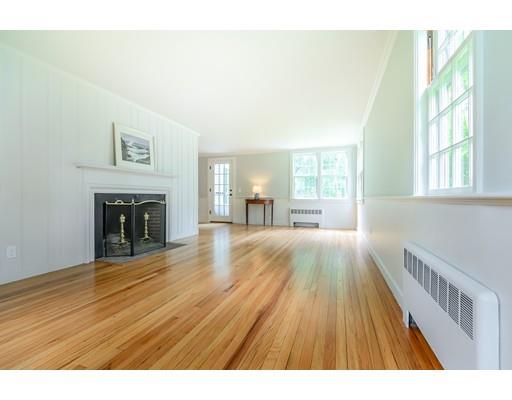 234 Highland Road Andover, MA 01810 - Photo 14 of 29 a view of empty room with wooden floor and fireplace