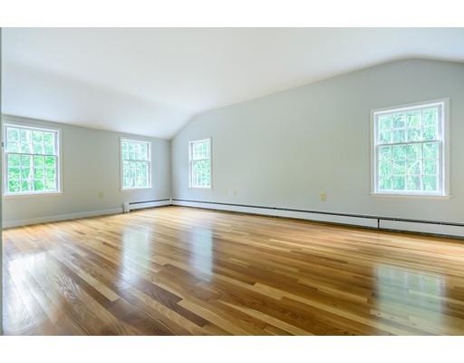 234 Highland Road Andover, MA 01810 - Photo 16 of 29 a view of empty room with wooden floor and fan