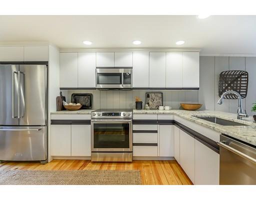 234 Highland Road Andover, MA 01810 - Photo 5 of 29 a kitchen with stainless steel appliances granite countertop a stove a sink and a refrigerator